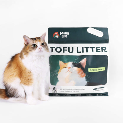 A 4.5 KG Bag of Mami Cat Tofu Litter Green Tea Scent, with a cute Calico Cat beside.