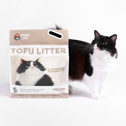 A 4.5 KG Bag of Mami Cat Tofu Litter White Tea Scent, with a cute tuxedo cat beside.