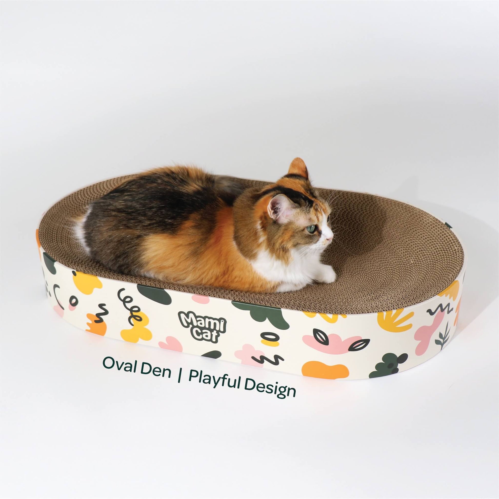 A Calico Cat nesting on top of Oval Den Cat Scratcher Board Playful Design.